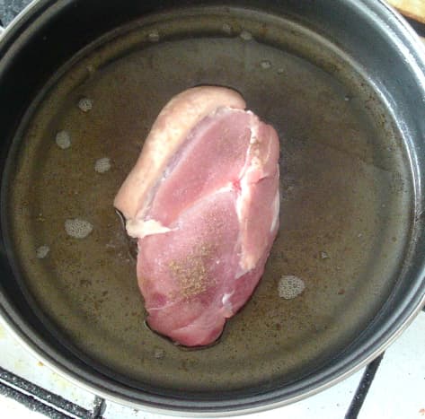 Seasoned pork fillet is put on to fry