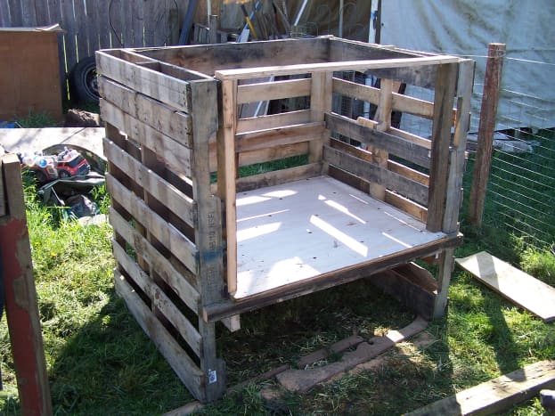 Constructing the coop out of pallets and plywood