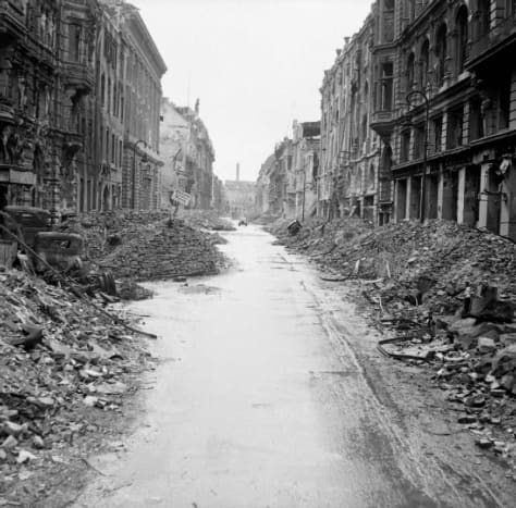 Street in Berlin 1945, it was the most bombed city in history, home to nearly four million civilians, by the end of the war would be the focus of 363 air raids forcing over 1.7 million of its citizens to flee the city.
