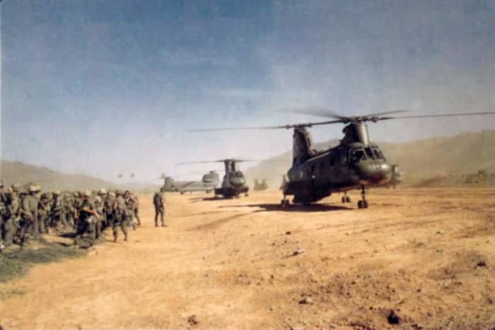  CH46s preparing to airlift Marines up to the ridge.