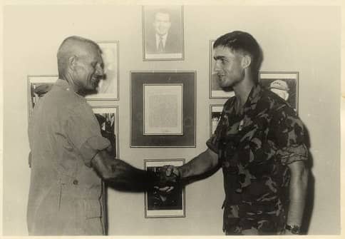 Mueller receiving his Bronze Star from 4th Marines CO, Col. Martin Sexton.