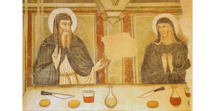 The two holy siblings share a meal and lively conversation.