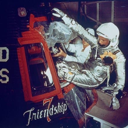 Friendship 7 artwork can be seen as John Glenn enters the capsule. Photo courtesy of NASA.