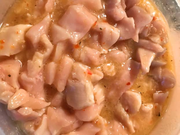 Marinate bite-sized pieces of uncooked boneless skinless chicken breasts overnight in Italian salad dressing. I prefer the bolder flavor of Wishbone salad dressing. Store in the refrigerator.