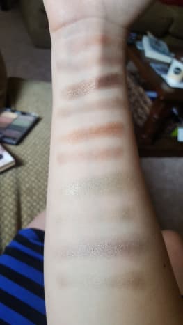 Finger and brush swatches from the right side of the palette (mostly browns and greens). From top to bottom: Myth, Magic, Wings, Marvel, and Trance.