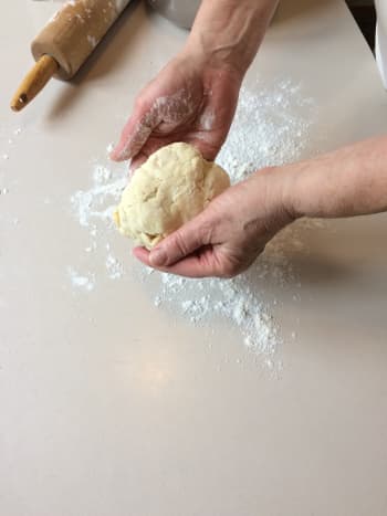 Place ball of dough on a lightly floured surface.