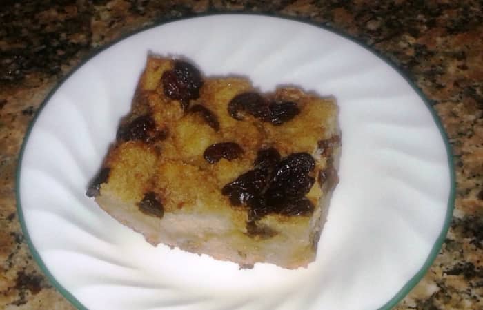 A slice of bread pudding ready to be garnished or eaten as is. 