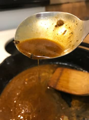 The finished pan sauce is slightly thickened, bursting with flavor and ready to serve.
