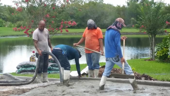 It took a full crew to spread the concrete as it was pumped to the patio. 