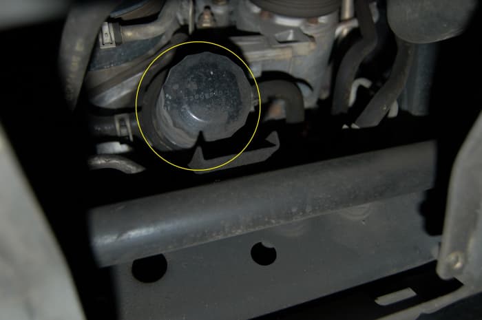 The oil filter is located towards the back of the access port.