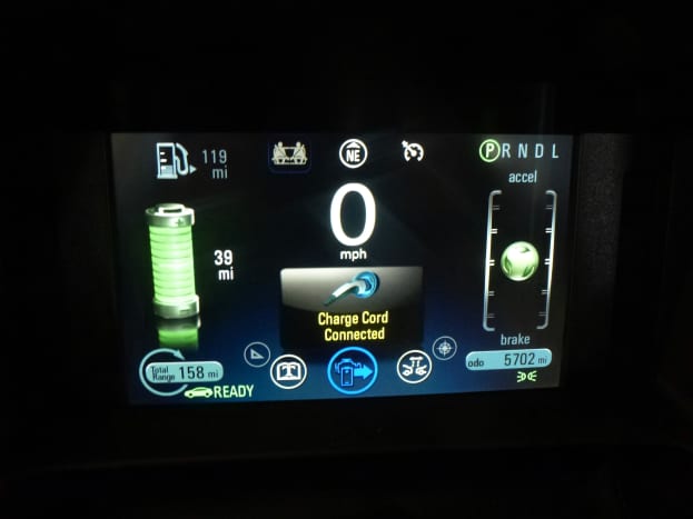 The dashboard sceen showing that the charge cord is plugged in. The car will not shift into gear.