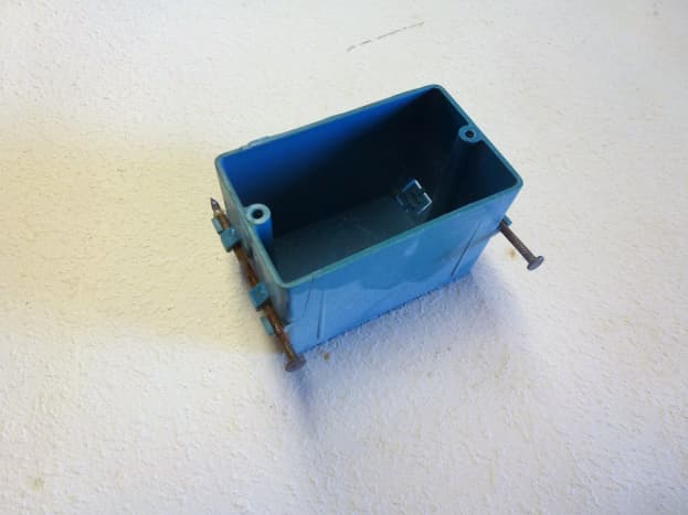 A plastic, single gang, box suitable for a 20 amp outlet.  This one requires it to be nailed to a stud, while others are designed for &quot;old work&quot; and do not need the wall to be opened up.