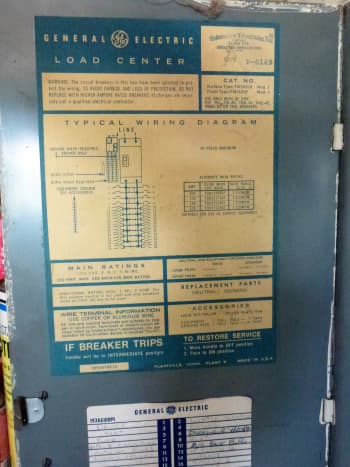 Typical label on the panel, specifying which breakers can be used.  Below it is the panel schedule, partially visible, with what each breaker is for handwritten in.