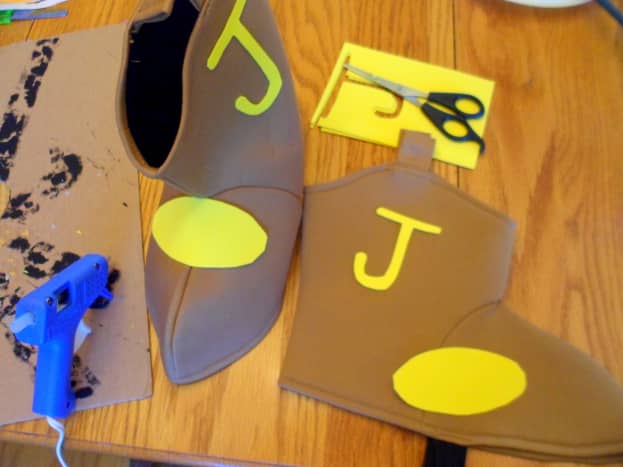 Cut two yellow ovals and the letter &quot;J&quot; out of craft foam sheets.