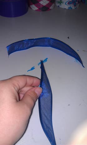 Cut enough blue to use for the tie at the end of the bow.