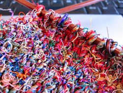 Knitting with silk sari yarn.