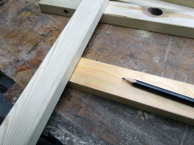 Using the timber as a template to mark the correct position for the joint.