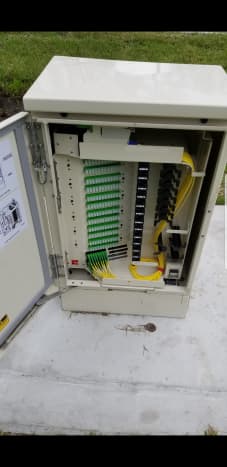 This is a PFP. Fiber that has been split is in, what we call, the parking lot at the bottom left. Just waiting to connect to the fiber ports at the top that go to your house.