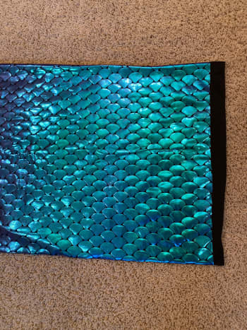 Purchased activewear fabric. The fish scales change from teal to pink with the light.