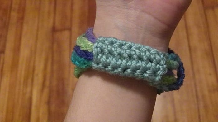 This is a chain stitch bangle with a crocheted band.