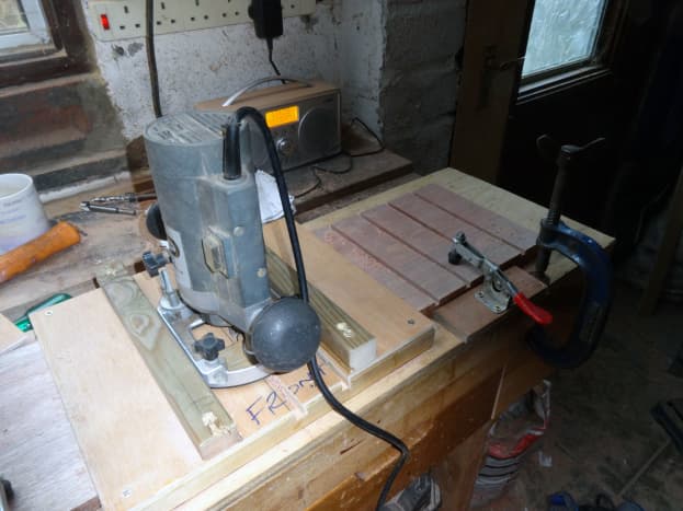 Using the jig to route the divider slots in the drawer sides