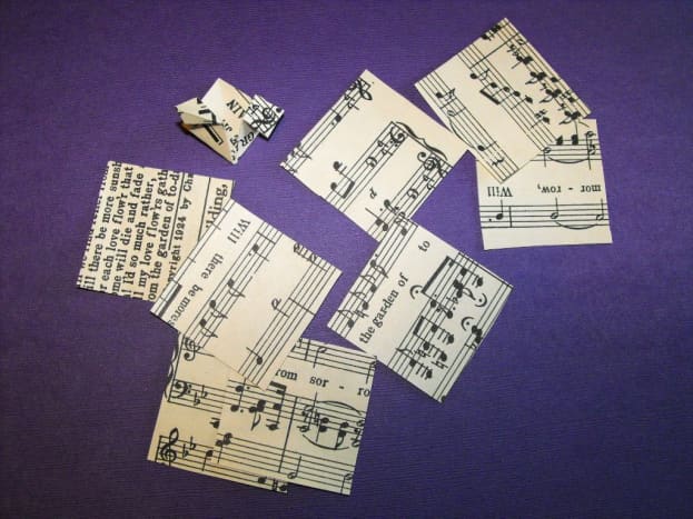 Cut eight 2 inch squares or tiles from old music paper. 