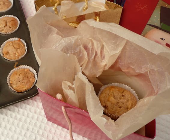 First, place greaseproof paper in you bag. Add muffins. 