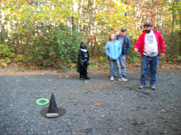 Brian didn't get any points on this try. You can see that we had to put a rock on the hat to keep it from blowing away. Note the line in the gravel to mark where to stand behind. 