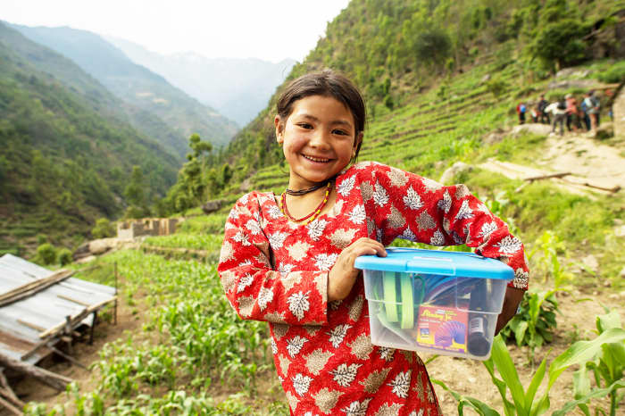 A girl holding her shoebox in Nepal.