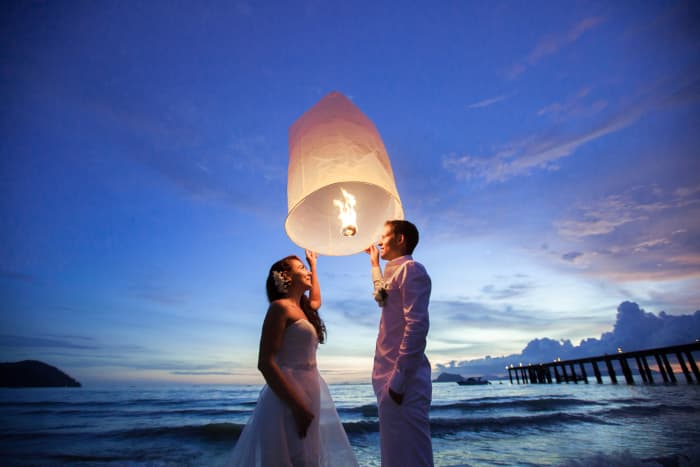 It is customary for newlyweds to light a lantern together in Thailand . . .