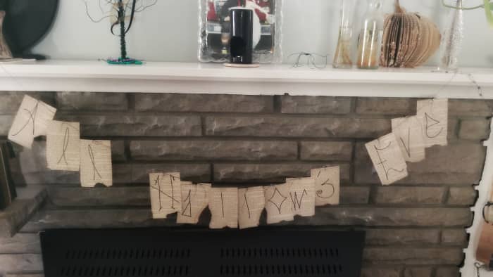 A unique book page banner for the fireplace.