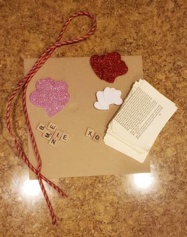 Materials needed for glitter and paper heart wreath