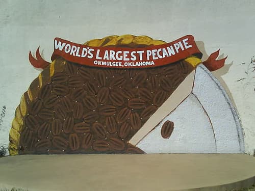 Okmulgee holds the worlds record for the largest pecan pie.  This mural can be found in a small park in the downtown Okmulgee historic district.