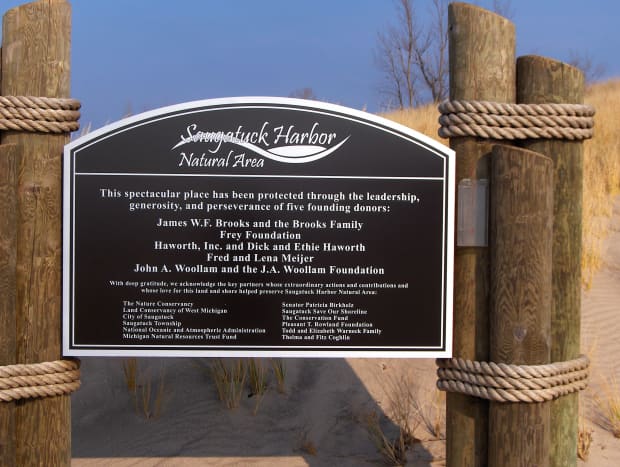 A proud dedication toward community efforts responsible for saving the pristine coastal dune landscape directly adjacent to Oval Beach's northern portion 