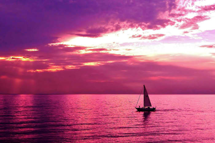 Sailing Into the Setting Sun at Oval Beach, Lake Michigan