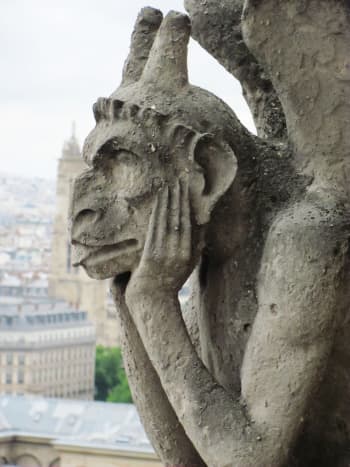 The infamous Spitting Gargoyle looked bored here. It was just another day hanging out in Paris.  (He's a stryge in classical lore -- a bird of ill omen that feeds on human flesh and blood.)