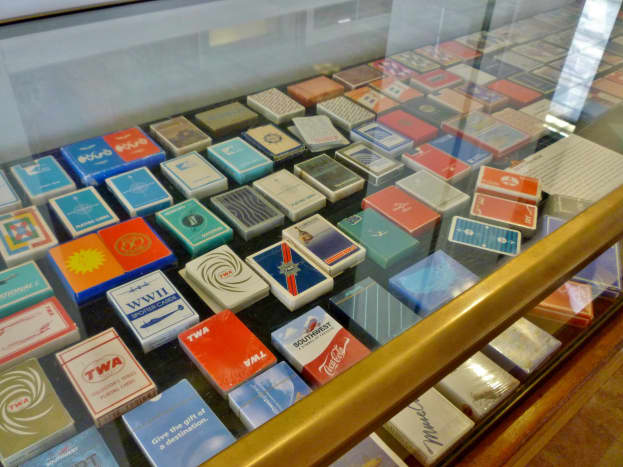 Display of playing cards distributed by different airlines at 1940 Air Terminal Museum
