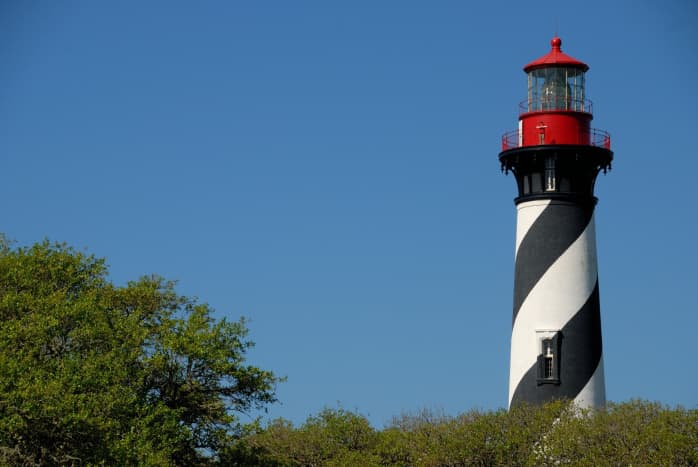 St. Augustine Lighthouse with its black and white spiral-striped tower. 