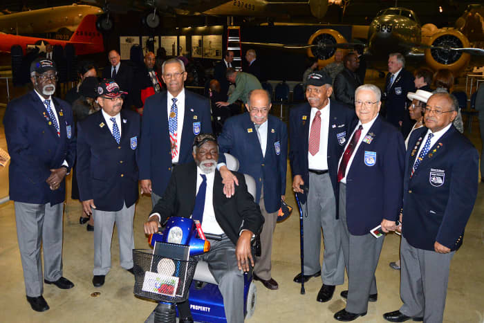 Tuskegee Airmen and Honorary Airmen gathered at the expanded Tuskegee Airmen exhibit in the WWII Gallery at the National Museum of the Air Force in 2015.