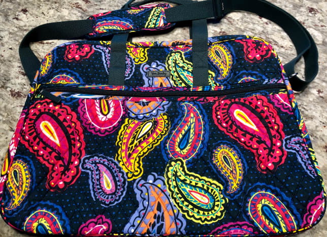 The Vera Bradley Grand Traveler Bag holds a ton and folds flat for easy storage in your cabin.