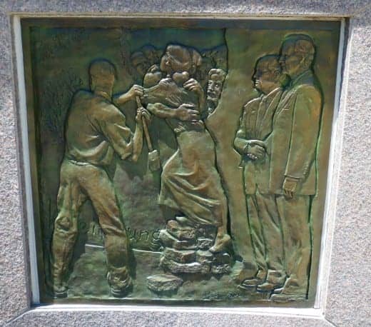 Bas Relief showing the Berlin Wall being torn down with Presidents Bush and Gorbachev to the side.
