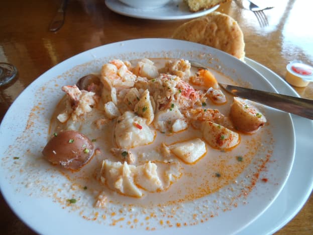 The broth was not as thick as clam chowder in Maine. The seafood included large pieces of haddock, lobster, succulent scallops, shrimp, and potatoes. It came with tasty biscuits and you can consider a bowl of this a whole meal. Yummy!