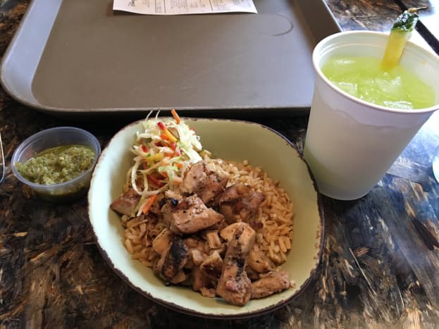 The children's chicken and rice bowl. It is brown rice, marinaded chicken, and a veggie slaw on the side. That green stuff is an aioli and is one of the sauce options for the adult version. A very well balanced and delicious meal.  