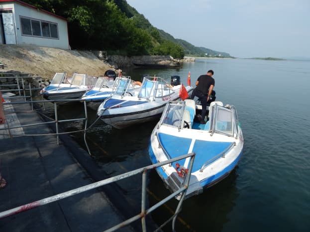A line of speedboats wait for customers. 