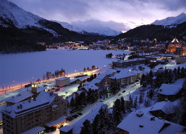 St. Moritz on a winter evening. The St. Moriz lake is frozen.