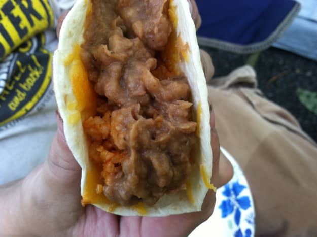 A vegetarian taco with beans and rice