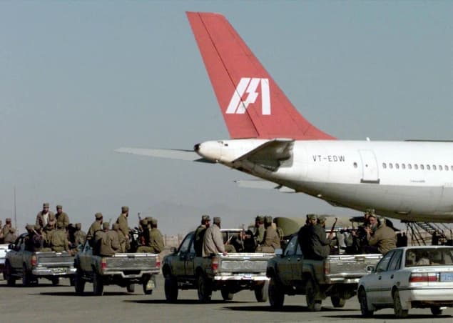 Taliban militia rushing towards the hijacked airliner
