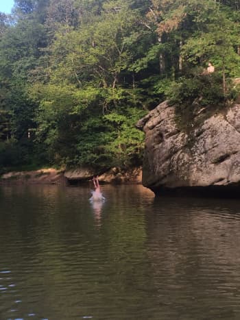 Cliff Jumping Into the River Close to Our Campsite