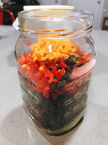 To soak the fruit mixture: In a jar, combine the dried fruits, glazed cherries, and orange zest. 