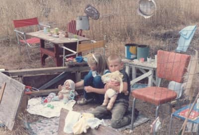 This picture was taken in Carmel Valley at the home of Kosta's parents. You can see the creativity of both children as they have made themselves a house to play in, using whatever materials they could find.